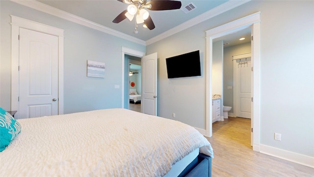 975 S Stingaree, Crystal Beach, TX 77650 - bedroom featuring light wood-style floors, baseboards, ornamental molding, a ceiling fan, and connected bathroom