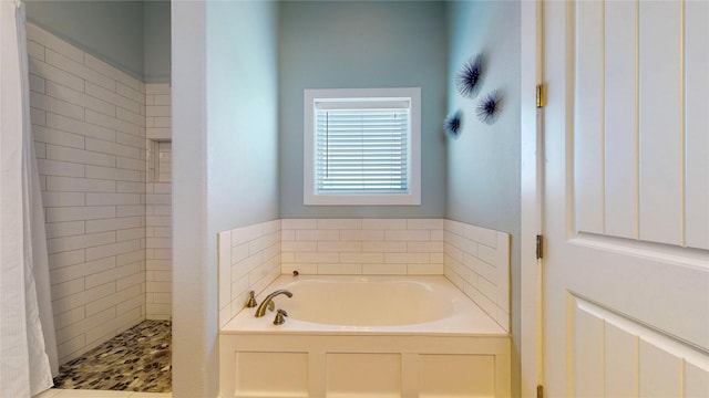 975 S Stingaree, Crystal Beach, TX 77650 - bathroom with a shower stall and a garden tub