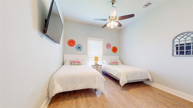 975 S Stingaree, Crystal Beach, TX 77650 - bedroom featuring light wood-style flooring, ceiling fan, and baseboards