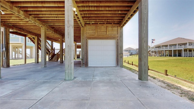 975 S Stingaree, Crystal Beach, TX 77650 - garage with a carport and driveway