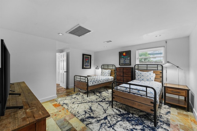 18 S Shore Dr S, Galveston, TX 77551 - bedroom with baseboards, visible vents, recessed lighting, and stone tile floors