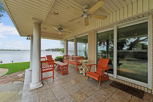 18 S Shore Dr S, Galveston, TX 77551 - view of patio with a ceiling fan and a water view