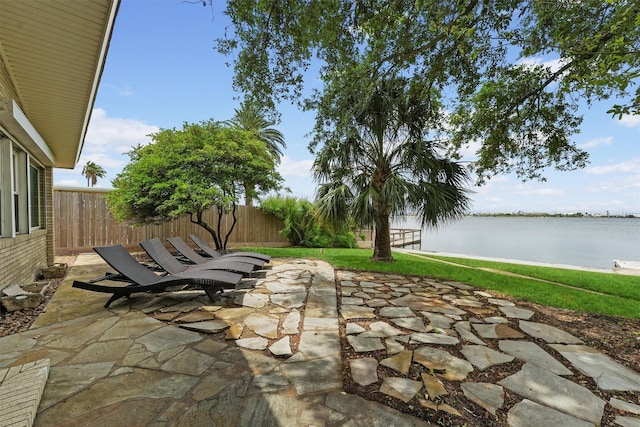 18 S Shore Dr S, Galveston, TX 77551 - view of patio / terrace with a water view and a fenced backyard