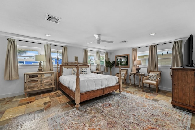 18 S Shore Dr S, Galveston, TX 77551 - bedroom featuring baseboards, recessed lighting, stone tile flooring, and visible vents