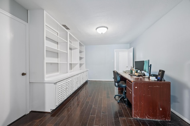 office with baseboards, visible vents, and wood finished floors