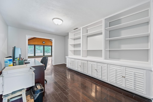 office with visible vents, baseboards, a textured ceiling, and wood finished floors