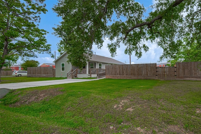 view of yard featuring a deck and fence