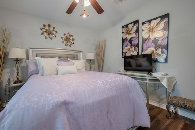 bedroom featuring baseboards, ceiling fan, and wood finished floors