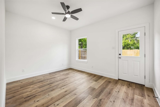 spare room with recessed lighting, baseboards, ceiling fan, and wood finished floors