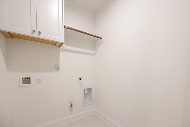 12810 Belford Gardens Dr, Humble, TX 77346 - washroom featuring hookup for a gas dryer, hookup for an electric dryer, baseboards, washer hookup, and cabinet space