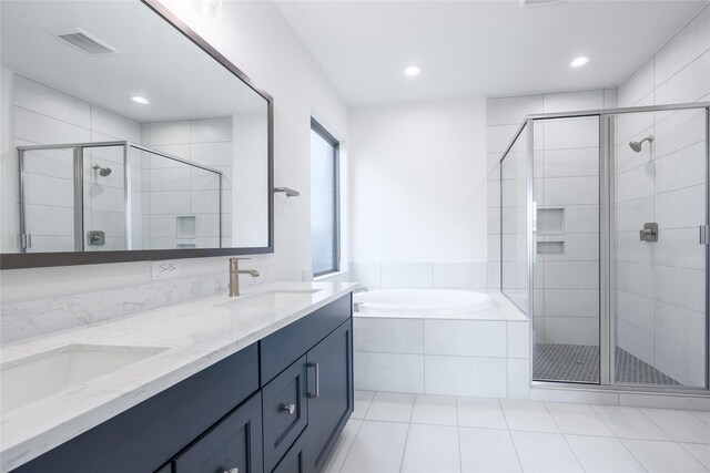 12810 Belford Gardens Dr, Humble, TX 77346 - full bathroom featuring a stall shower, tile patterned floors, a bath, double vanity, and recessed lighting