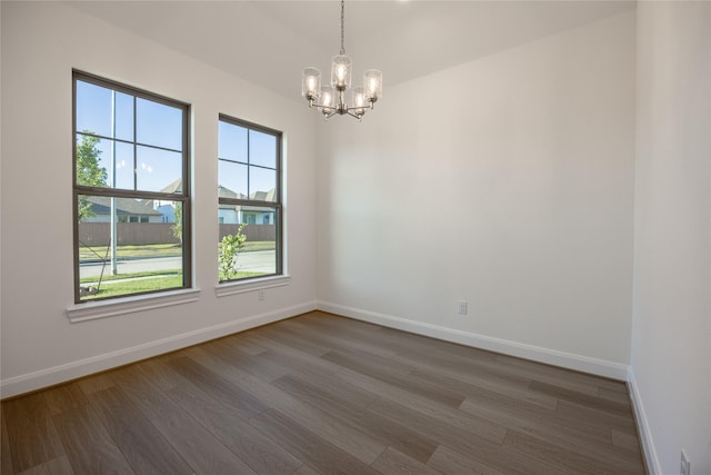 12810 Belford Gardens Dr, Humble, TX 77346 - empty room with plenty of natural light, a chandelier, and wood finished floors