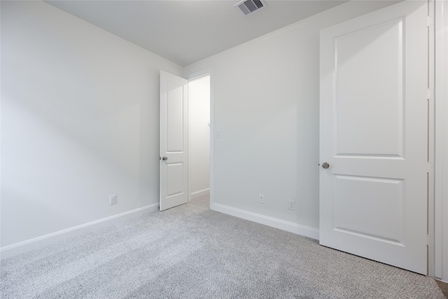 12810 Belford Gardens Dr, Humble, TX 77346 - unfurnished bedroom featuring light colored carpet and baseboards