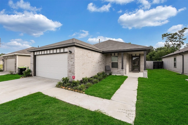 view of front facade featuring fence, a front lawn, brick siding, a garage, and concrete driveway