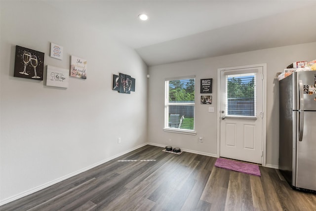doorway to outside with recessed lighting, baseboards, dark wood finished floors, and vaulted ceiling