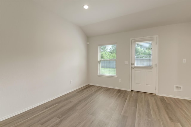 254 Cumberland Forest Dr, Magnolia, TX 77354 - empty room featuring light wood finished floors, baseboards, lofted ceiling, and recessed lighting