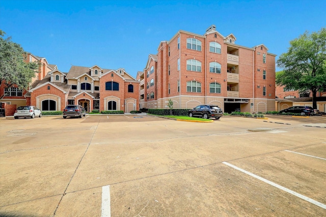 view of property with uncovered parking