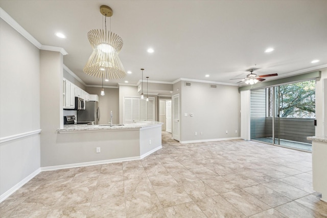 unfurnished living room with recessed lighting, a ceiling fan, ornamental molding, and a sink