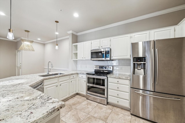 kitchen featuring light stone counters, a sink, appliances with stainless steel finishes, and ornamental molding