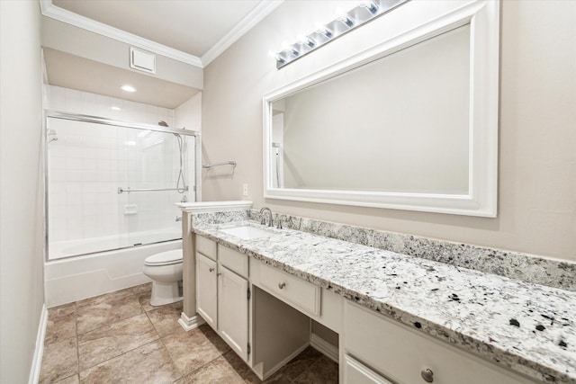 full bath featuring crown molding, vanity, shower / bath combination with glass door, toilet, and baseboards