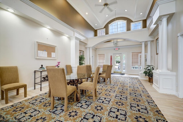 interior space featuring recessed lighting, a ceiling fan, ornate columns, and a wealth of natural light