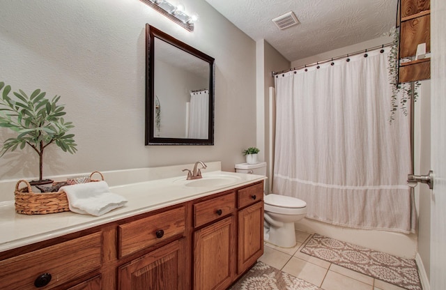 5906 Sugar Bush Dr, Magnolia, TX 77354 - full bathroom featuring vanity, toilet, tile patterned floors, a textured ceiling, and shower / bathtub combination with curtain