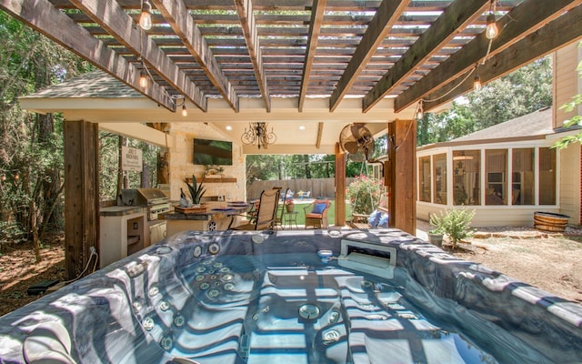 5906 Sugar Bush Dr, Magnolia, TX 77354 - view of swimming pool featuring grilling area, a sunroom, a hot tub, an outdoor kitchen, and fence