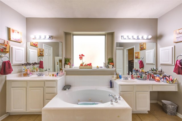 full bath with a jetted tub, tile patterned flooring, a sink, and two vanities