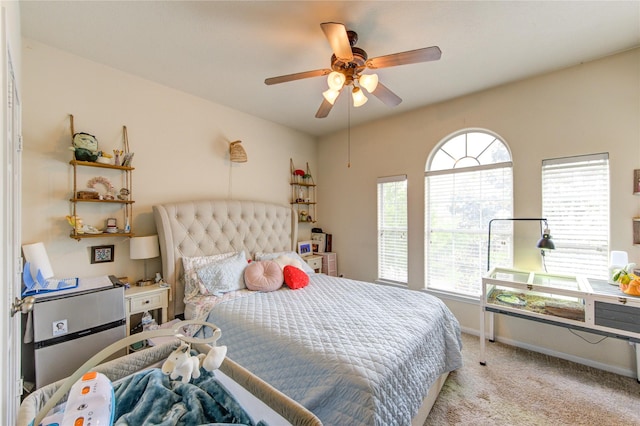 bedroom featuring carpet floors, baseboards, and ceiling fan