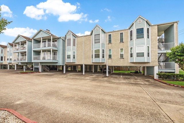 view of building exterior with covered parking