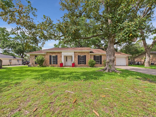 single story home featuring a garage, driveway, and brick siding