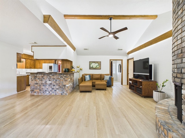 living room with beamed ceiling, high vaulted ceiling, ceiling fan, and light wood-style flooring