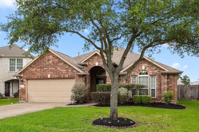 view of front of home featuring fence, an attached garage, concrete driveway, and brick siding