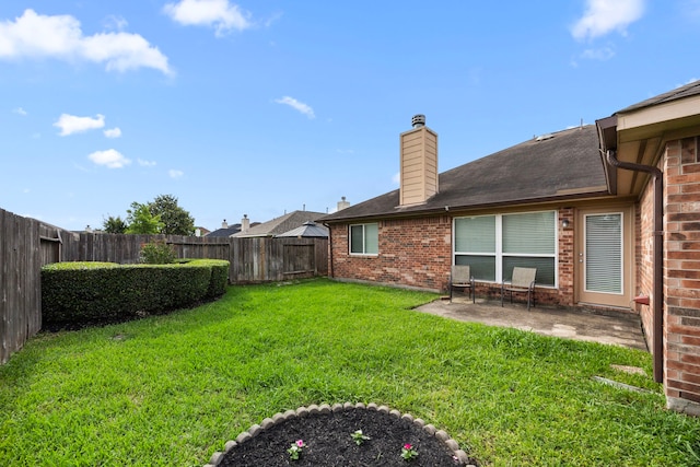 view of yard with a fenced backyard and a patio