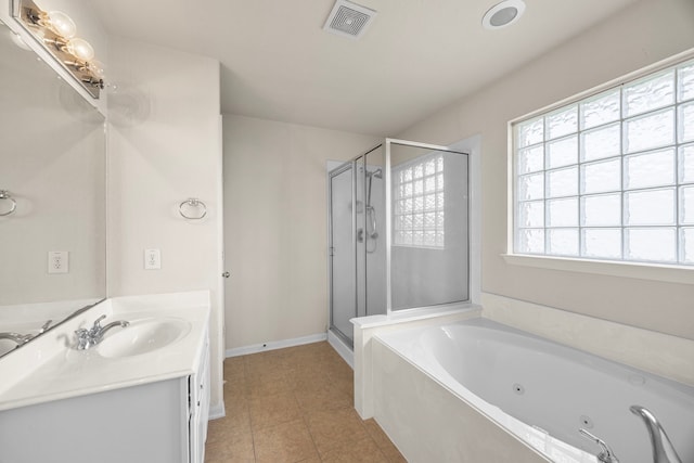 bathroom featuring tile patterned flooring, vanity, a whirlpool tub, a shower stall, and visible vents