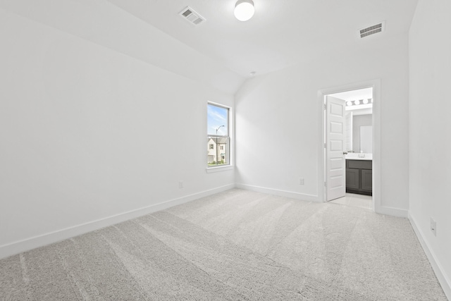 unfurnished bedroom with visible vents, baseboards, and light colored carpet