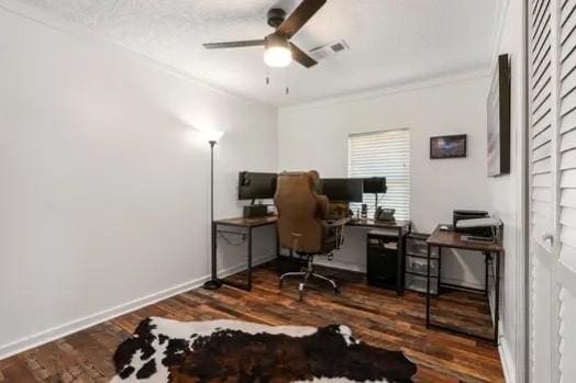 home office featuring ornamental molding, a ceiling fan, wood finished floors, and visible vents