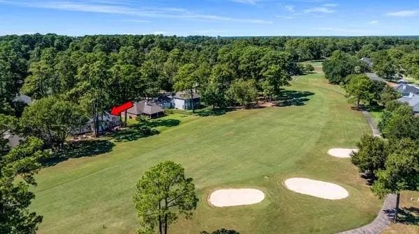 bird's eye view with view of golf course