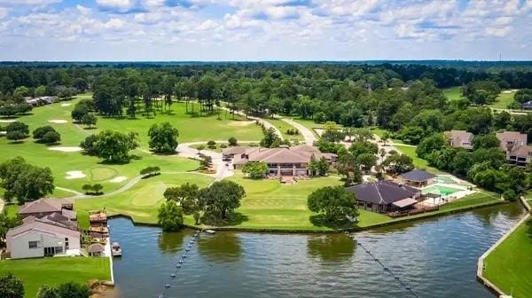 bird's eye view with view of golf course and a water view