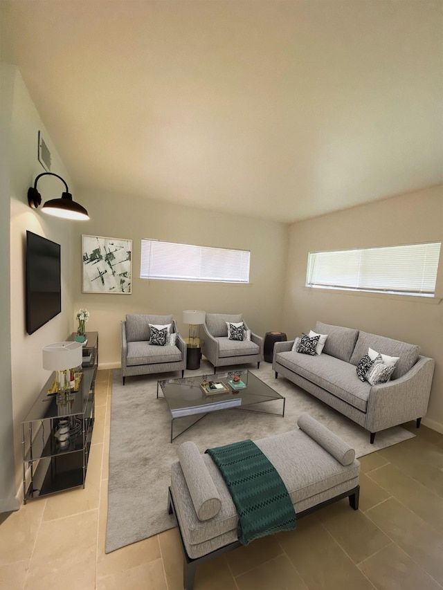living area featuring tile patterned flooring and visible vents