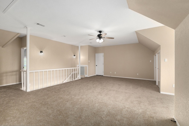 additional living space featuring ceiling fan, visible vents, vaulted ceiling, and carpet