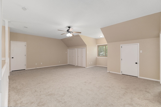 bonus room featuring ceiling fan, lofted ceiling, baseboards, and carpet