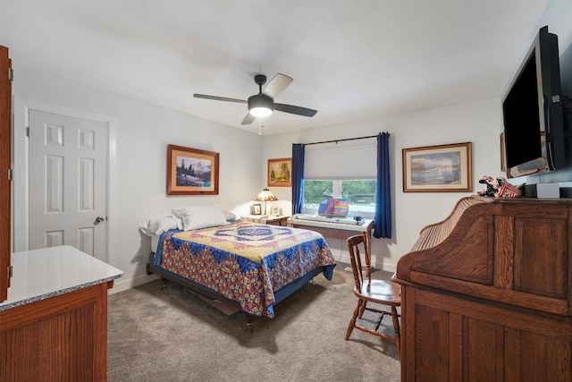 bedroom with baseboards, a ceiling fan, and light colored carpet