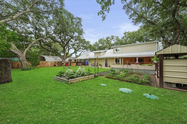 view of yard featuring a garden and fence
