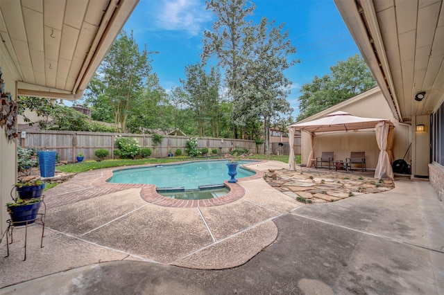 5611 Westerham Pl, Houston, TX 77069 - view of pool with a fenced backyard, a gazebo, a pool with connected hot tub, and a patio area