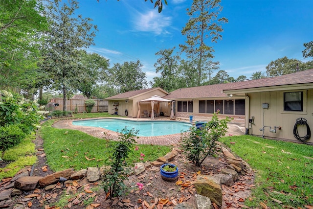 5611 Westerham Pl, Houston, TX 77069 - view of swimming pool with a sunroom, fence, a yard, and a fenced in pool