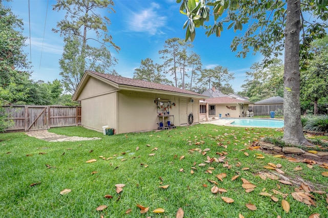 5611 Westerham Pl, Houston, TX 77069 - rear view of property with a yard, a fenced in pool, a gate, and a fenced backyard