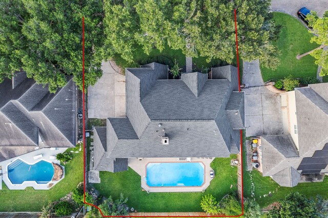 view from above of property featuring a pool and property boundaries highlighted