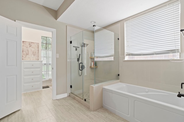 full bath featuring a bath and a stall shower