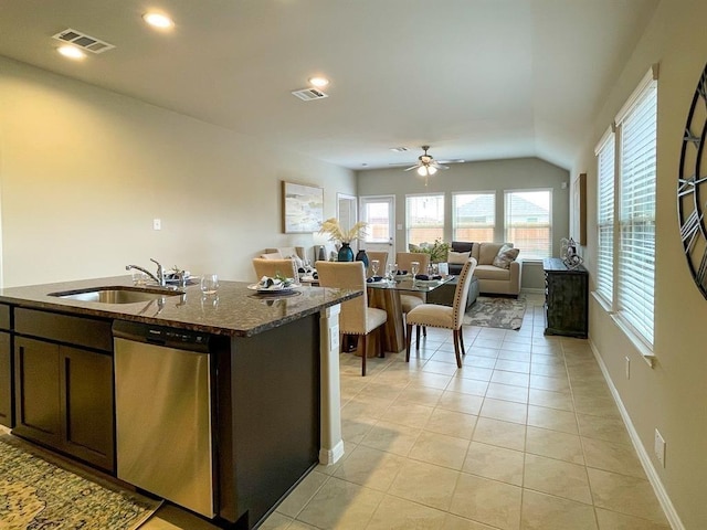 kitchen with stainless steel dishwasher, a sink, ceiling fan, and visible vents